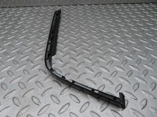 R129 SL right headlight lower trim used OEM