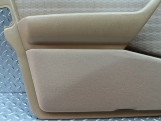 W124 front left door card beige used OEM