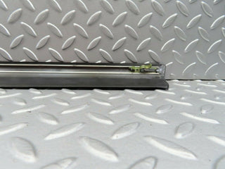W123 front left door lower trim used OEM