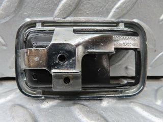 W123 chrome frame for door opener left used OEM