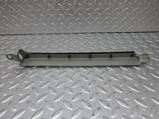 W124 under headlight trim right side used OEM