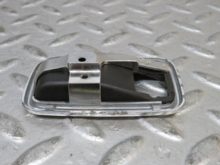 W123 chrome frame for door opener left used OEM