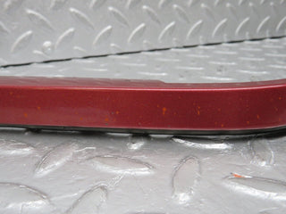 R129 SL left headlight lower trim used OEM