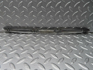 R107 SLC trunk chrome handle moulding used OEM