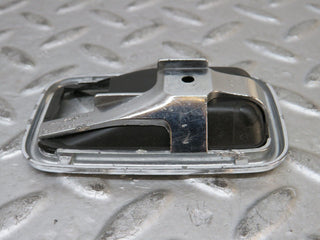 W123 chrome frame for door opener left used OEM