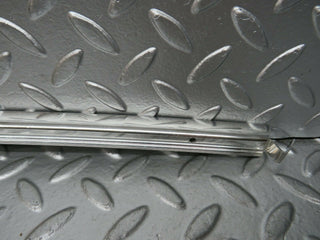 W108 rear left chrome window channel used OEM
