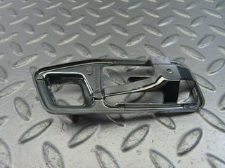 W123 chrome frame for door opener left used OEM