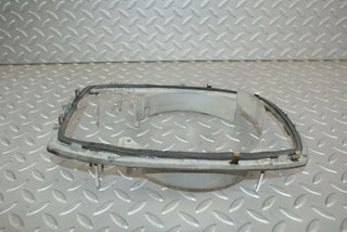 W115 headlight frame used OEM