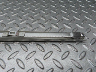 W111 rear left door front chrome window channel used OEM