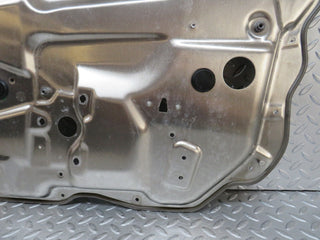 W221 front left window regulator support panel used OEM