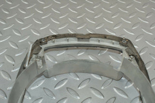 W115 headlight frame used OEM