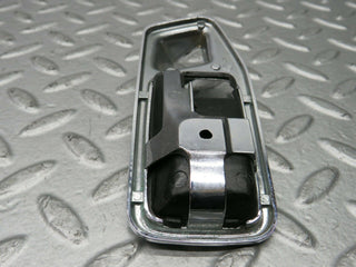 W123 Wagon chrome frame for door opener left used OEM