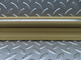 W123 front left door sill trim beige used OEM