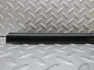 W123 front left door sill trim black used OEM