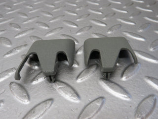 W124 front seat rail trim cover pair used OEM