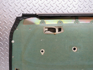 W123 front left door card black used OEM