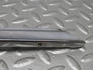 W109 front left door chrome window frame used OEM