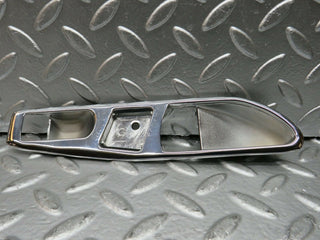 R107 SLC interior door handle chrome surround left side used OEM