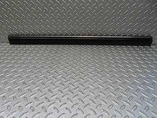 W123 front left door lower trim used OEM