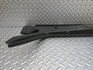 W124 trunk lock trim panel used OEM