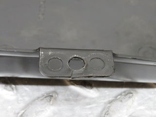 W109 rear axle mount plastic cover used OEM