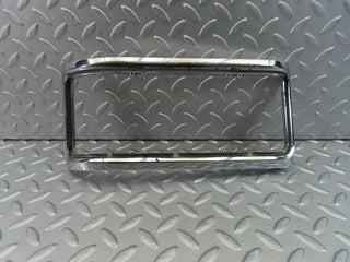 W115 tail light chrome frame left used OEM