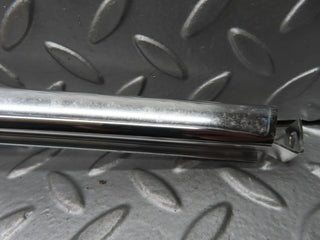 W123 rear left door chrome window channel used OEM