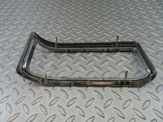 W115 tail light chrome frame left used OEM