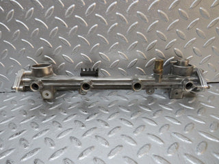 W124 Wagon fuel injector rail used OEM