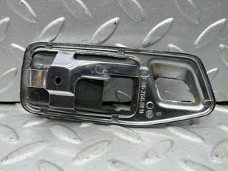 W123 Wagon chrome frame for door opener left used OEM