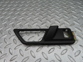 W124 front door opener frame left used OEM
