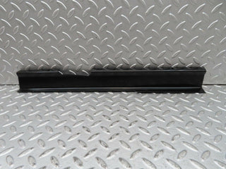 W123 front left cable channel cover used OEM