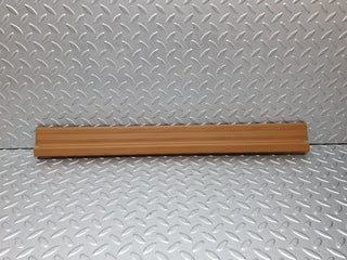 W124 front right door sill trim palomino used OEM