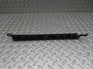W140 headlight lower trim left side used OEM