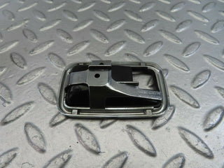 W123 chrome frame for door opener right used OEM
