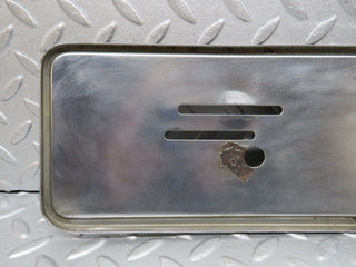 W123 front chrome number plate holder used OEM