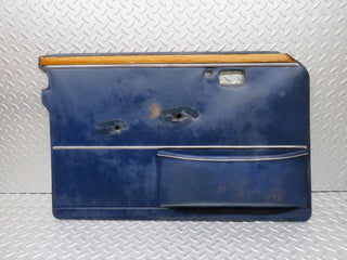 W109 front left door card blue used OEM