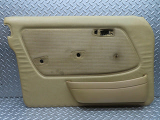 W123 front left door card beige used OEM