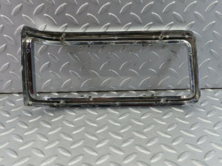 W115 tail light chrome frame left used OEM