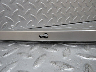 R129 SL left headlight lower trim used OEM