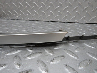 R129 SL left headlight lower trim used OEM