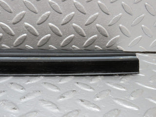 W123 rear right door sill trim black used OEM