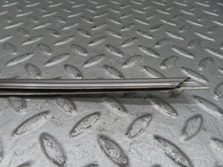 W123 rear left door window chrome frame used OEM