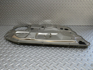 W221 front right window regulator support panel used OEM