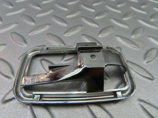 W123 chrome frame for door opener left used OEM