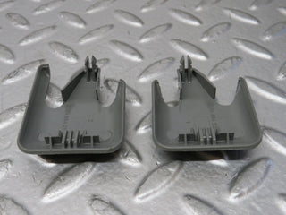 W124 front seat rail trim cover pair used OEM