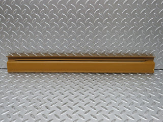 W123 front right door sill trim palomino used OEM