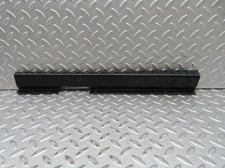 W123 front left cable channel cover used OEM