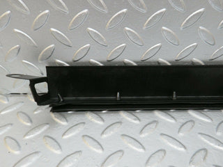 W124 Wagon under headlight trim left used OEM
