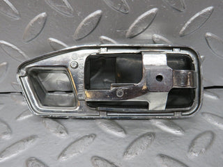 W123 chrome frame door handle front left used OEM